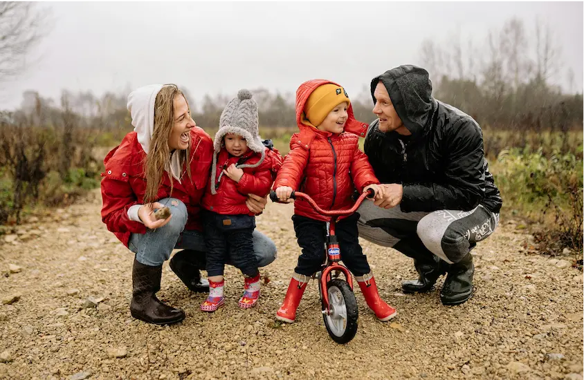 Life and Health Insurance Solutions​ family outside with raincoats